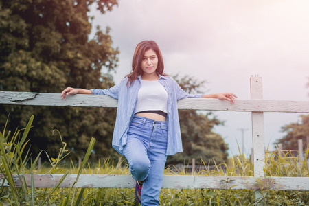 Beautiful young woman portrait with sunrise.の写真素材