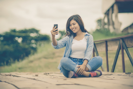 Fashionable Young Woman with her Mobile Phone.の写真素材