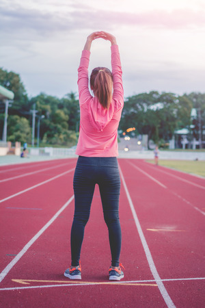Beautiful woman fitness sunrise jogging workout wellness concept.の写真素材