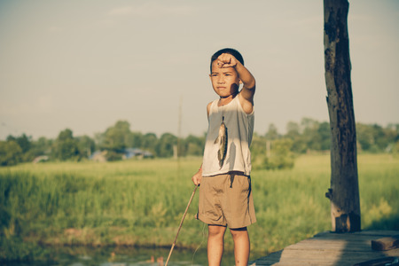Little Boy Catching a Fish. Kids Fishing.の写真素材