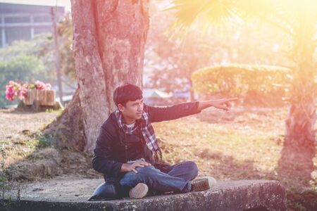 Lifestyle portrait of winter man with vintage camera taking photo.の写真素材