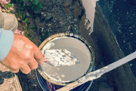 Men painted roadside sidewalk on the town's main road.の写真素材