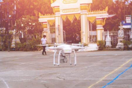 White drone, quadrocopter with photo camera flying concept.の写真素材