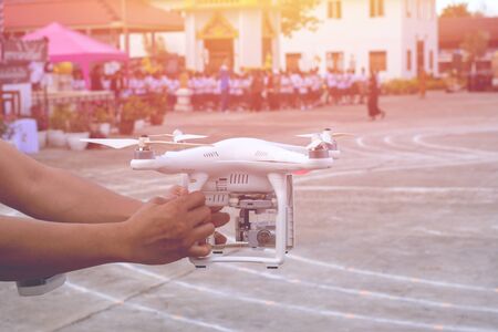 Man holding drone with hand outdoor.の写真素材
