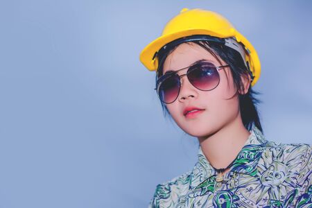 Female engineer with construction worker and steamroller, road construction concept.の写真素材