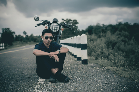 Mechanic with motorcycle .Vintage style.の写真素材