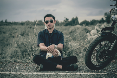 Mechanic with motorcycle .Vintage style.