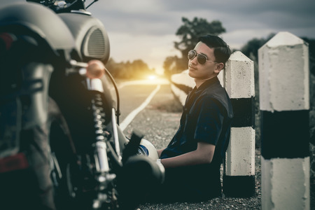 Mechanic with motorcycle .Vintage style.の写真素材