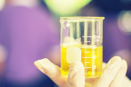 Students are mixing chemicals learning in science in class.の写真素材