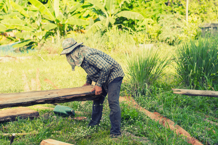 Construction man  worker lifting wooden.の写真素材