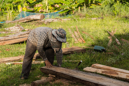 Construction man  worker lifting wooden.の写真素材