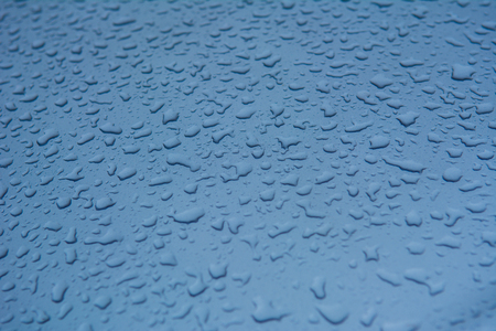 Rain drops on the car surface, Driving in rain,texture background.の写真素材