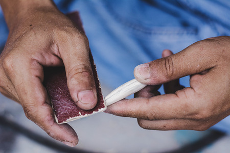 Hand made fishing lures. Making handcrafted fishing lures made of wood.の写真素材