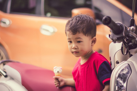 Children eating ice cream in the summer.の写真素材