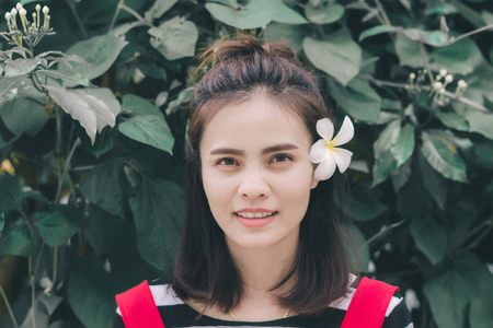 Portrait of hipster woman in green background, Hobby concept.の写真素材