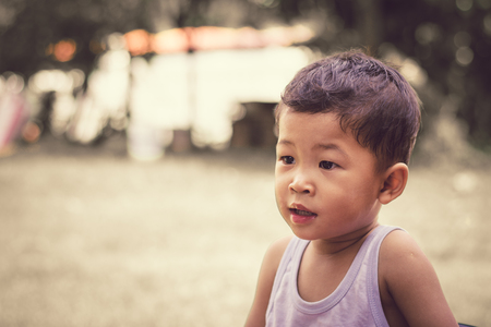 close up portrait of a child boy sad.の写真素材