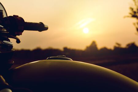 Cose-up silhouette of motorbike on sunset background,Enjoying freedom and active lifestyle.