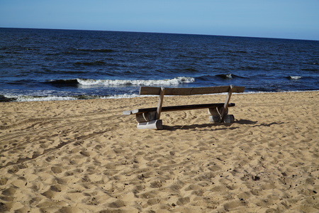 Lonely bench on the beachの写真素材
