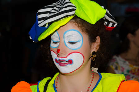 Mamaia, Constanta, Romania, July 25, 2013 â Young lady clown doing her magics on the street with lots of balloons in a summer evening on the Black Sea coast.のeditorial素材