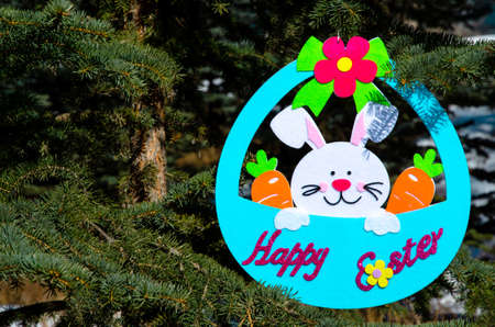 Easter decoration showing an egg with a bunny and couple carrots