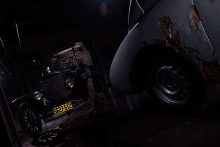 Moscow Russia November 2 2019: Ford Model T black color car with old gray retro car in garageのeditorial素材