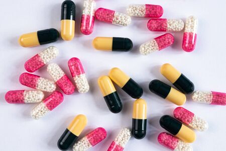 colorful drugs and capsules on a white backgroundの写真素材