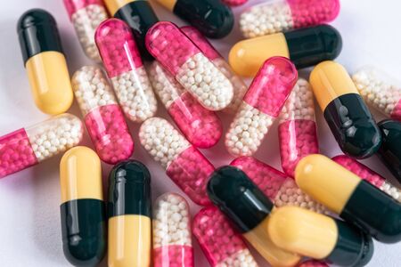 colorful drugs and capsules on a white backgroundの写真素材