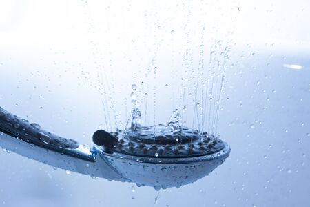 Shower Heads with spray of water in the bathroomの写真素材