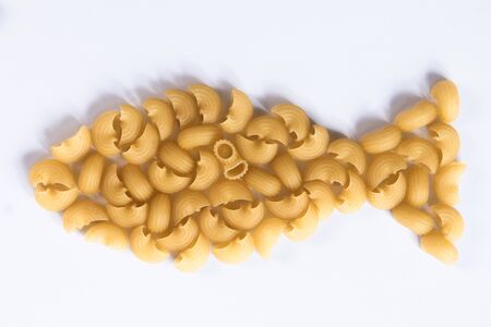 still life game fish many yellow pasta closeup macroの写真素材