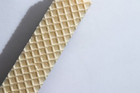 crispy waffle with cream and chocolate filling on a white backgroundの写真素材