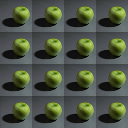still life ripe fresh green granny apple on a gray background patternの写真素材