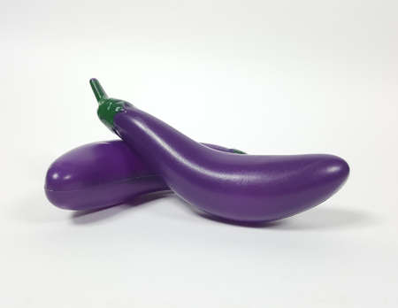 Eggplant plastic toy And a white backdropの写真素材