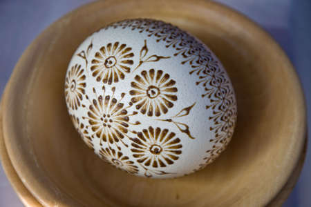 Easter eggs on the wooden plateの写真素材