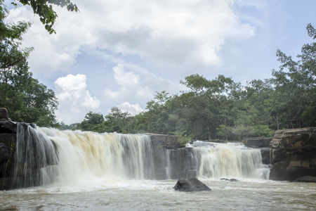 Waterfalls, sky and green trees.の写真素材