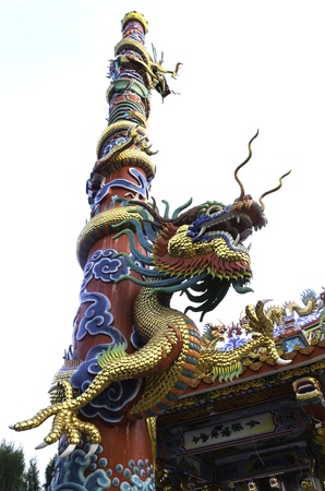 The chinese golden dragon with blue skyの写真素材