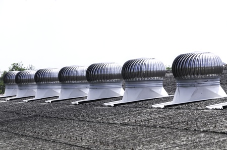 Ventilators on the roof of the factoryの写真素材