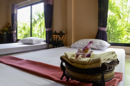 white bed and red towel in spaのeditorial素材
