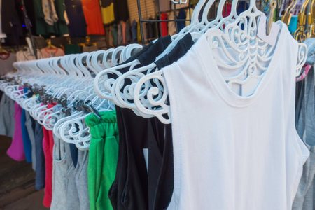 Clothes on hangers in a clothes shopの写真素材