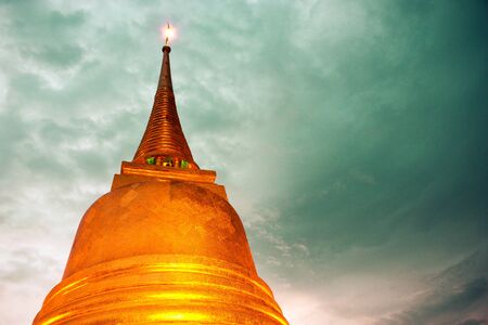 Golden pagoda with blue skyの写真素材