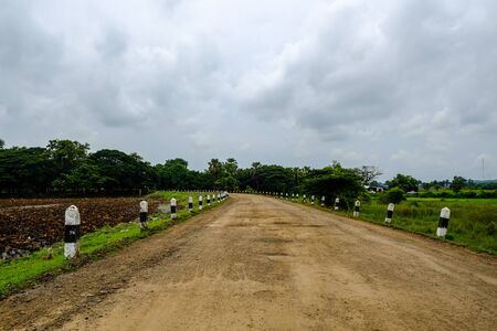 Non-asphalt road in upcountry Buriram, Thailandの写真素材