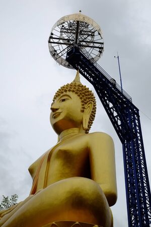 golden buddha with steel structureの写真素材