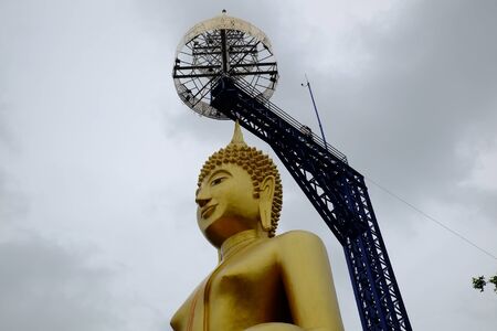 golden buddha with steel structureの写真素材