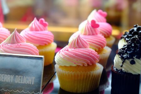 Colorful cupcake in the showcaseの写真素材