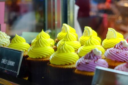 Colorful cupcake in the showcaseの写真素材