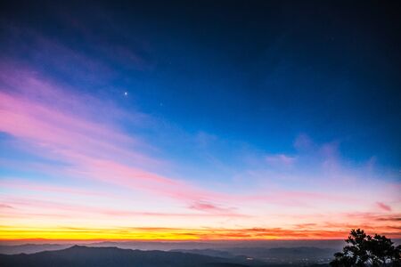 sky shading in the morning from orange to blueの写真素材
