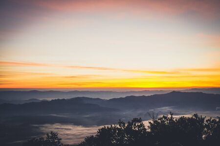 sky shading in the morning from orange to blueの写真素材