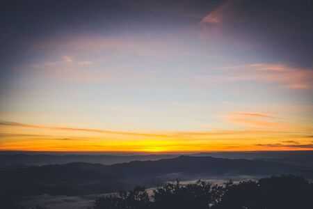 sky shading in the morning from orange to blueの写真素材