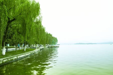grand lake with white sky background and treesの写真素材
