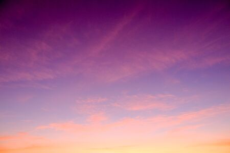 sunset sky shading background from orange to blueの写真素材