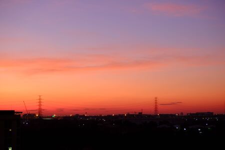 sunset sky shading background from orange to blueの写真素材